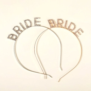 Macro detail of 'BRIDE' lettering set with sparkling rhinestones in gold and silver