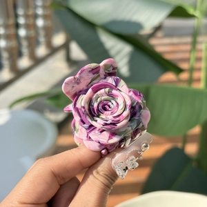 Detail of pink and purple marble texture rose hair clip in acetate fiber