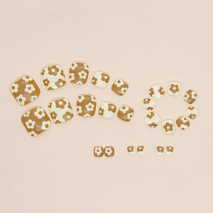 Short press-on toenails with brown and cream floral patterns and glossy finish