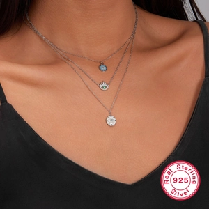 Three-layer 925 sterling silver evil eye layered necklace on model for women