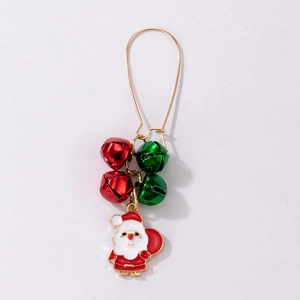 Close-up of Christmas earrings with gold hooks, red and green bells, and Santa charms