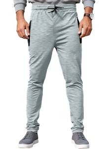 Detail of men's gray joggers featuring elastic drawstring waist and side zipper pockets