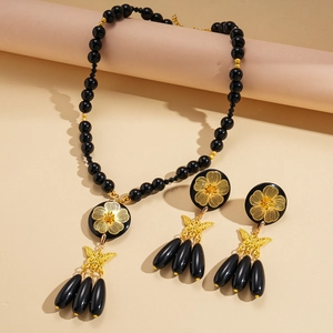 Gothic beaded necklace set with gold flower and butterfly pendants in black finish