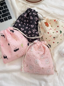 Kawaii drawstring storage bags in various patterns made of bubble textured fabric