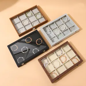 12-grid jewelry storage box with glass lid and metal clasp in various wood finishes