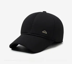 Close-up of winter baseball cap featuring textured thick fabric and a metal mountain logo