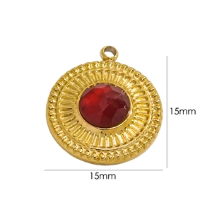 Detail showing a 15mm gold round pendant with a faceted red stone and sunburst texture