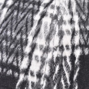 Macro texture of black and white plaid wool fabric for baseball cap with thick plush fibers