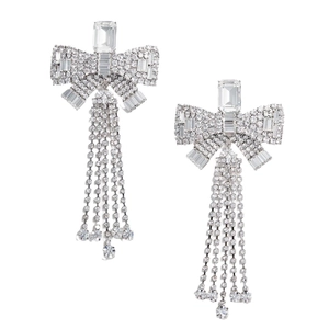 Elegant silver bow earrings with long rhinestone tassels and stepped cut stones on white back