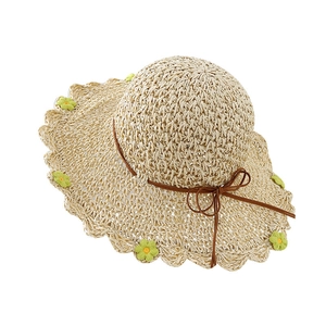 Women's straw beach hat with wavy brim, floral accents and ribbon, beige summer sun hat