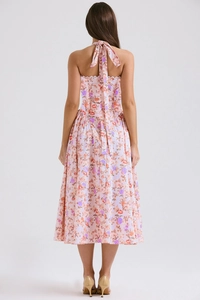 Detail of summer halter dress back design with vibrant floral patterns in pink and orange