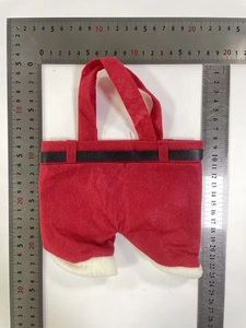 Vue détaillée des dimensions du sac cadeau pantalon de Noël avec règles de mesure