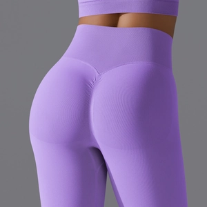 Close-up of purple high-waisted seamless yoga pants featuring scrunch butt lifting detail