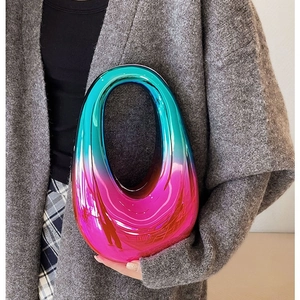 Elegant acrylic clutch bag with vibrant gradient finish and hollow handle for evening parties