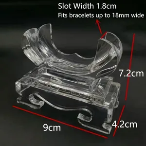 Clear acrylic bracelet display stand showing dimensions and curved support slot for jewelry