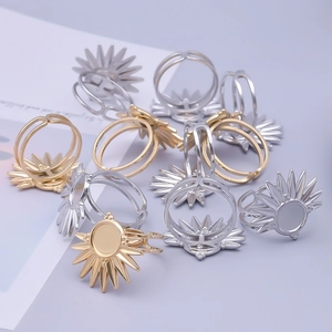 Macro detail of sunburst design ring settings in gold and silver for DIY jewelry