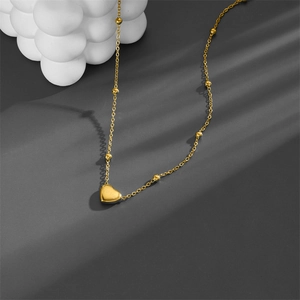 Elegant gold titanium steel heart necklace with delicate beads and minimalist pendant