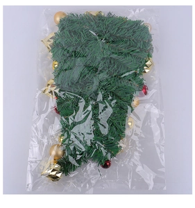 Detail of Christmas wall hanging decoration with gold and red baubles in packaging