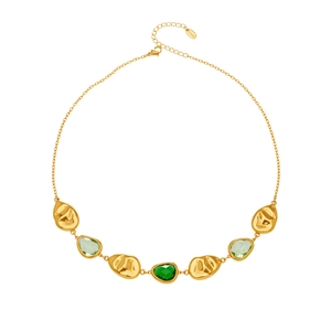 Elegant stainless steel gold necklace featuring green gemstones and textured discs