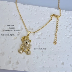 Detailed close-up of 18K gold plated bear pendant with sparkling AAA+ cubic zirconia