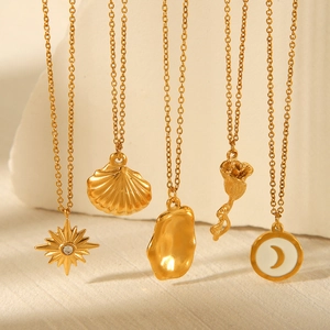 Detail of five gold stainless steel necklaces with sun, shell, and rose pendants
