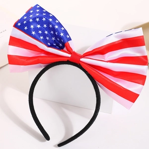 Detail of satin American flag bow headband featuring red, white, and blue colors