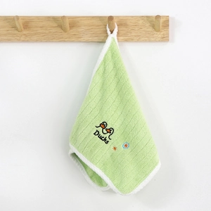 Close-up of a green coral fleece towel featuring cute duck embroidery and hanging loop