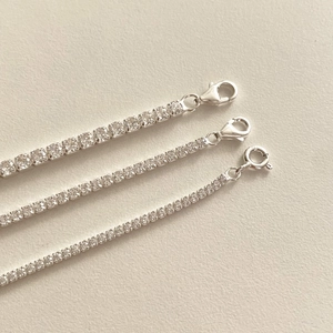 Macro detail of 925 sterling silver tennis bracelets showing 2mm, 3mm and 4mm zircon sizes
