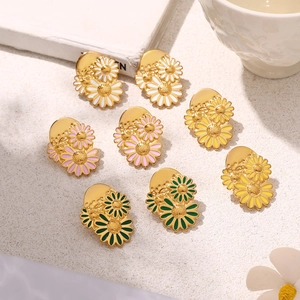 Chic 18k gold-plated daisy stud earrings in four colors on a minimalist background