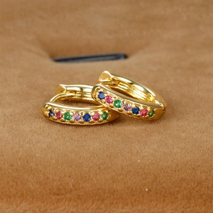 Detail of 18K gold plated hoop earrings with multi-colored cubic zirconia in velvet box