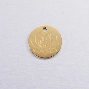 Detailed view of a gold-plated stainless steel lotus flower birthday pendant charm
