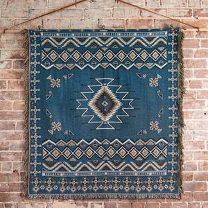 Close-up of Bohemian tapestry weave with geometric diamonds and fringe edges