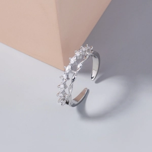 Detail of silver double-layered open ring with sparkling marquise zircons and twisted rope design
