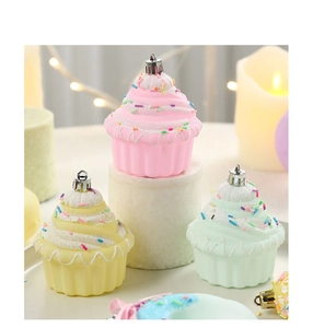 Close-up of pastel cupcake Christmas ornaments with glitter details and hanging loops