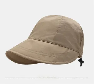 Detail view of adjustable drawstring buckle on a beige wide brim quick-dry sun hat