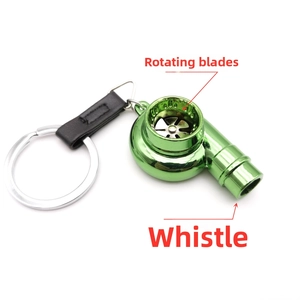Detail view of electroplated green turbo keychain with rotating fan and whistle feature