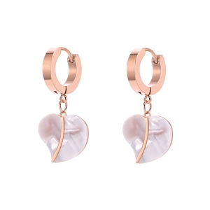 Rose gold hoop earrings with white heart-shaped shell pendants in minimalist design