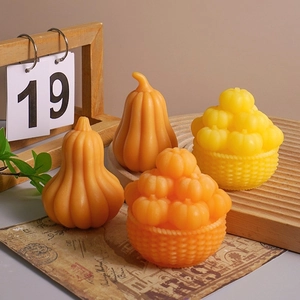 Halloween pumpkin scented candle set with orange and yellow autumn harvest basket decorations