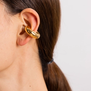Textured 18K gold plated stainless steel hollow cylinder ear cuff shown on a model