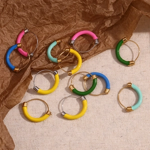 Detailed flat lay of colorful enamel hoop earrings in 18K gold plated stainless steel