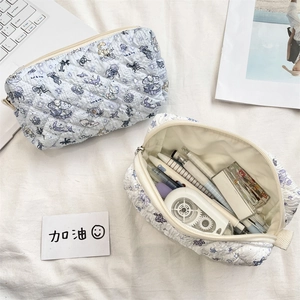 Close-up of quilted floral pencil case set with large storage for stationery and pens