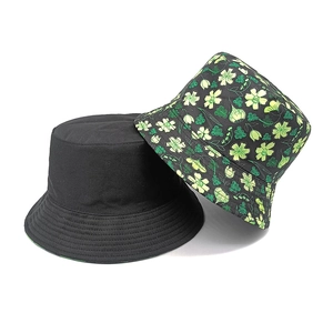 Double-sided reversible bucket hat with floral print and solid black cotton canvas design
