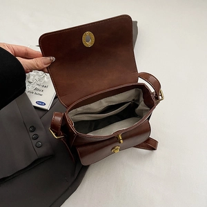 Vintage brown PU leather crossbody bag with dual buckles and golden clasp detail