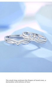 Detailed macro view of 925 silver couple rings featuring a twisted design and zircon inlay