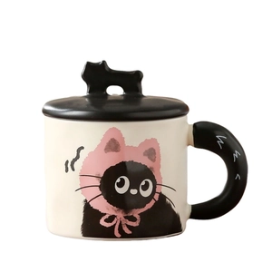 Ceramic cat mug with black lid and cute black cat handle on a white background