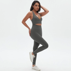 Detailed close-up of seamless charcoal grey yoga set featuring a cross-hem sports bra
