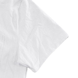 Detailed close-up of white linen shirt fabric texture and shoulder seam stitching