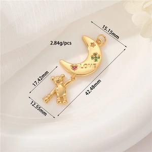 Detailed size view of a 14K gold moon and bear pendant with zircon and LOVE engraving