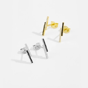 Detailed macro view of S925 silver geometric bar earrings with black and white zircon stones