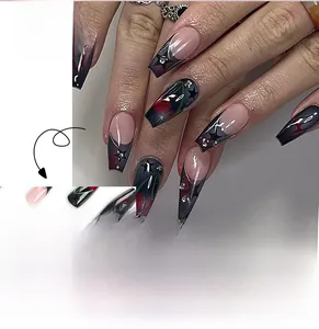 Detail of long coffin press-on nails with dark rose star designs and rhinestones